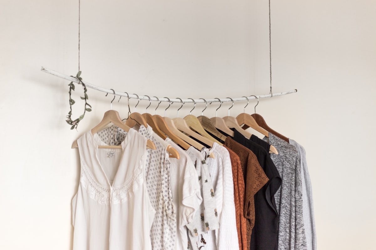 A considered, neutral-toned wardrobe styled on a rail